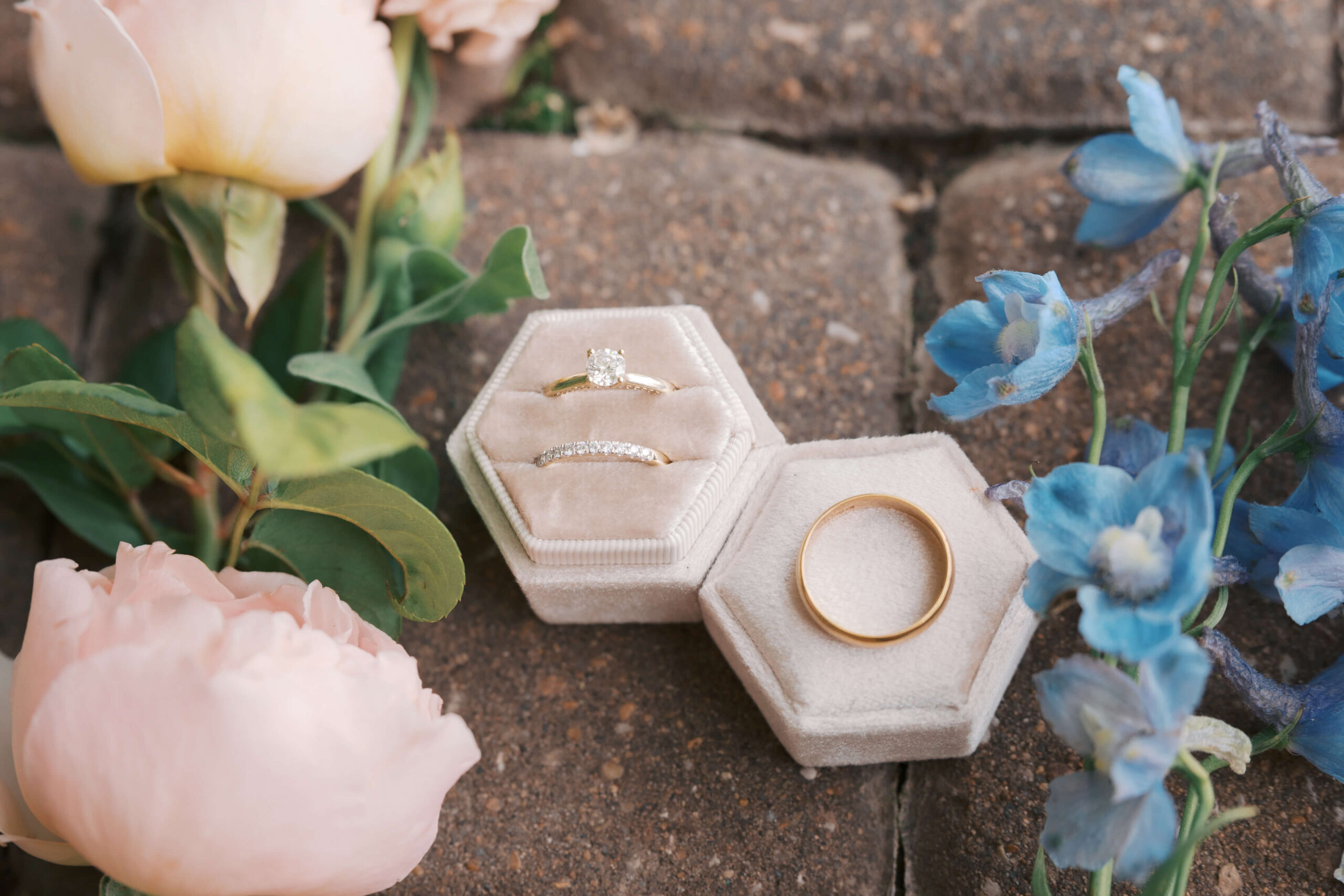 Ring details with pink and blue flowers on brick pavers