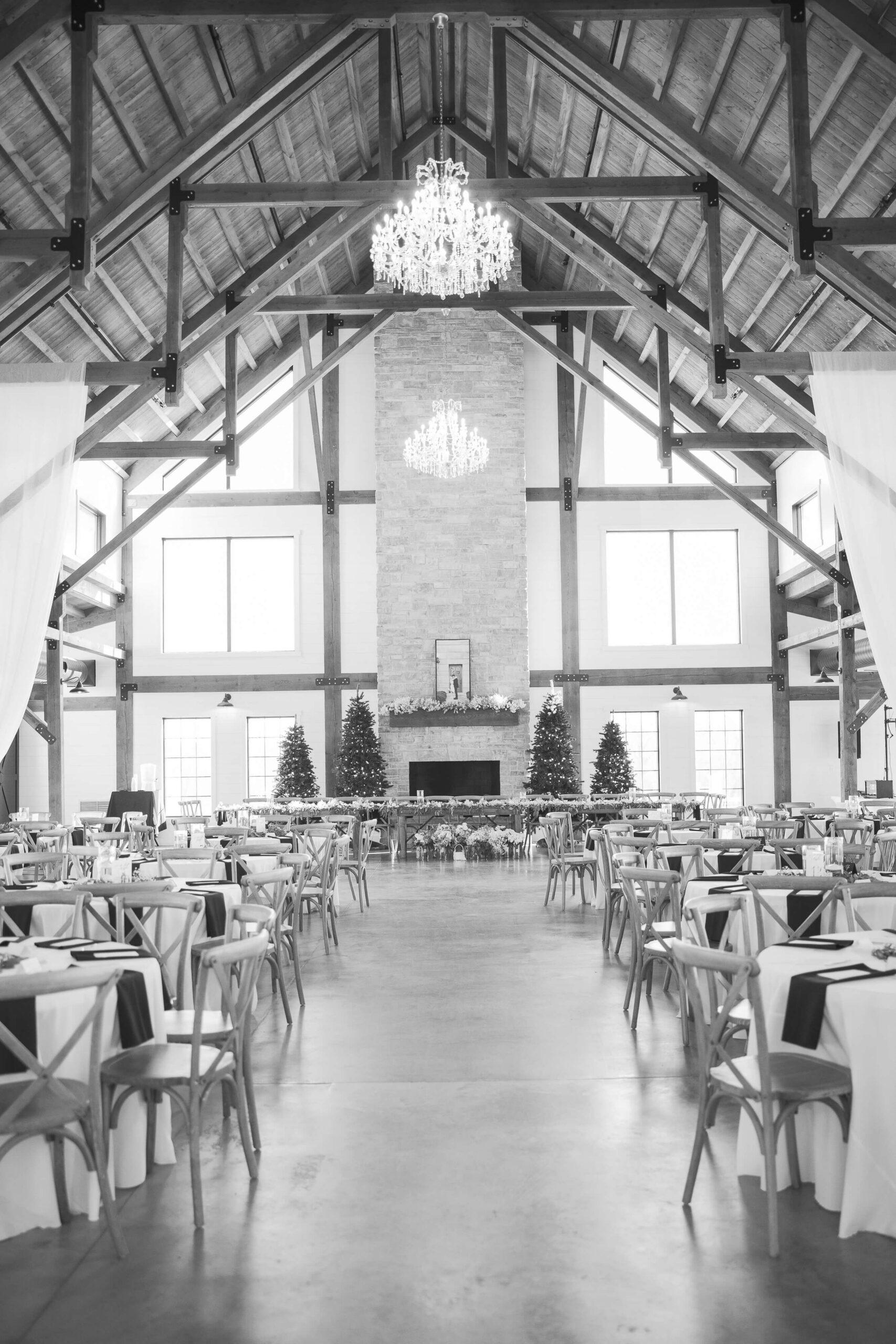 Details of a wedding reception table set up in the Seven Willows wedding venue under exposed beams