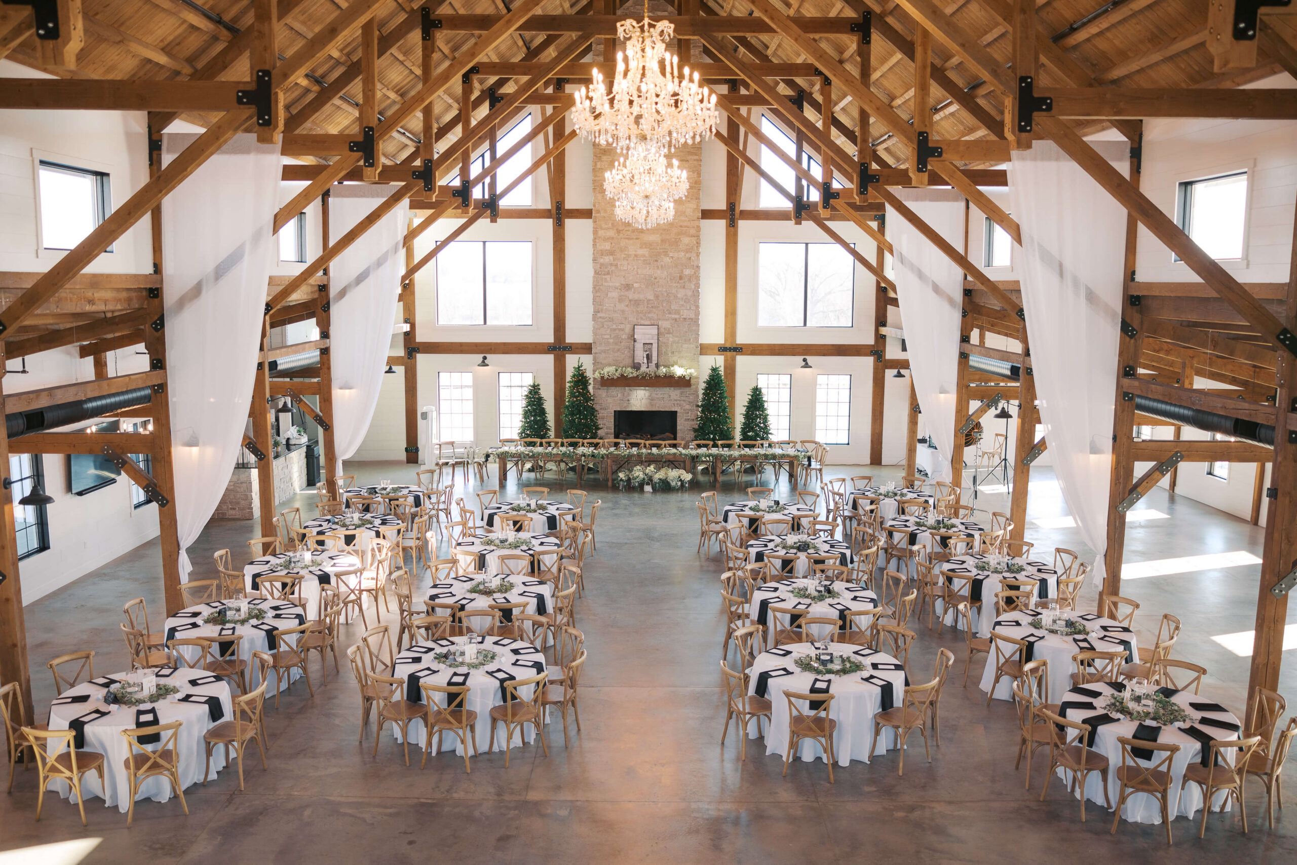Details and a look down from a balcony to a reception set up at Seven Willows wedding venue