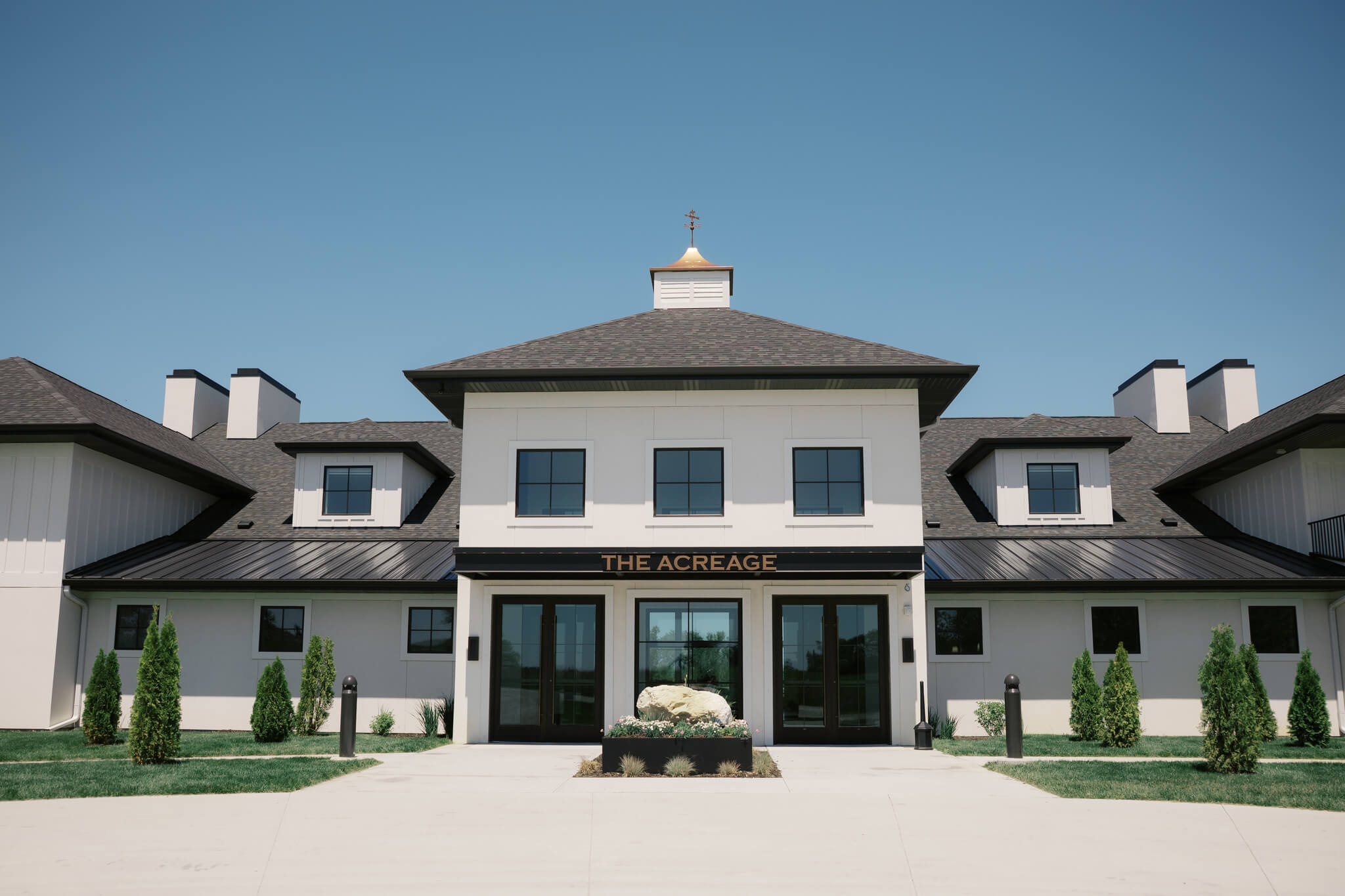 Details of the front entrance and facade of The Acreage wedding venue
